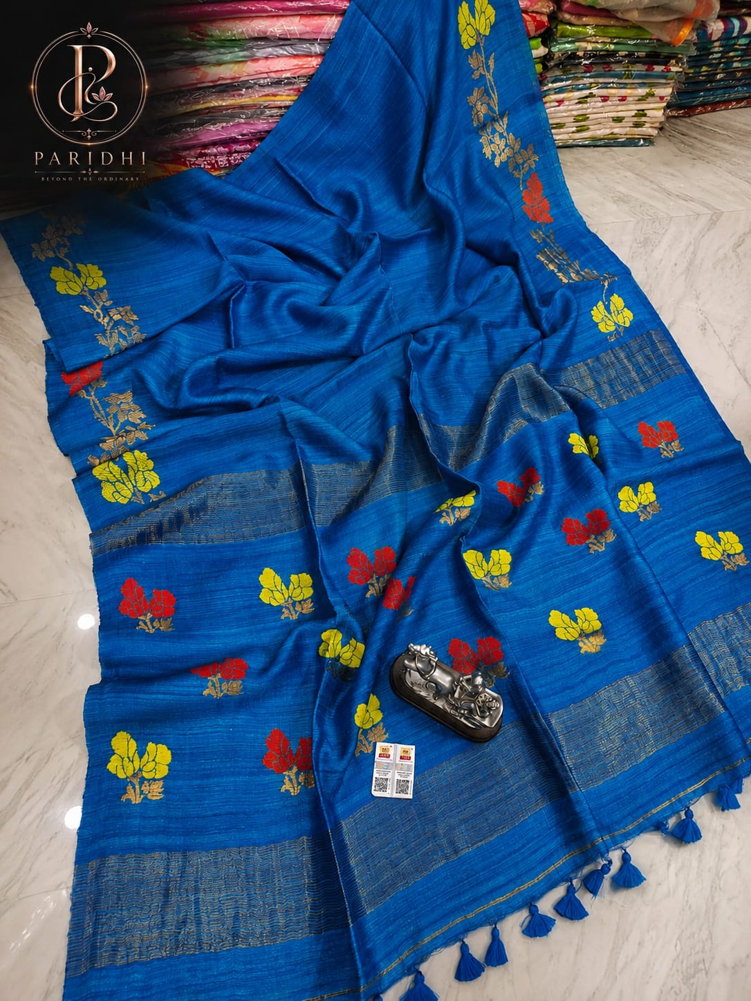Azure blue Motka Benarasi saree with hand-woven floral buta and zari border