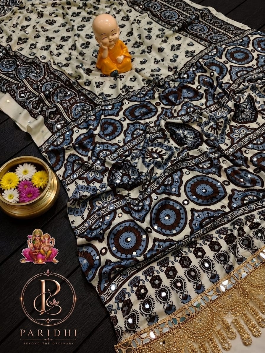 Ivory modal silk saree with coffee brown and blue print and mirror work