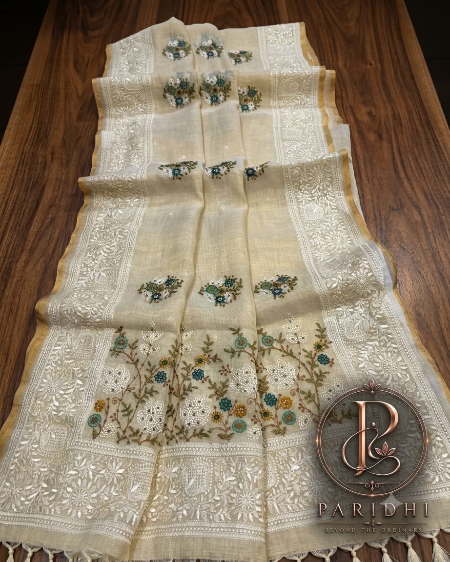 Ivory linen tissue saree with teal and marigold resham work