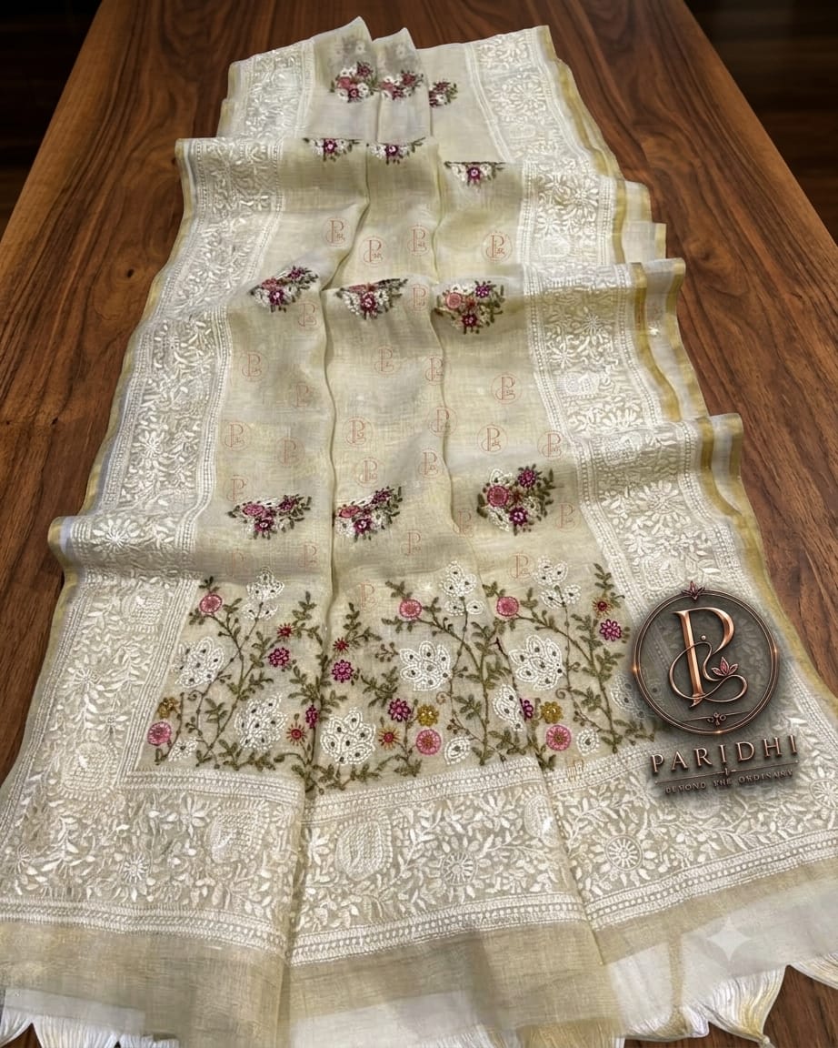 Ivory linen tissue saree with pink and wine resham embroidery