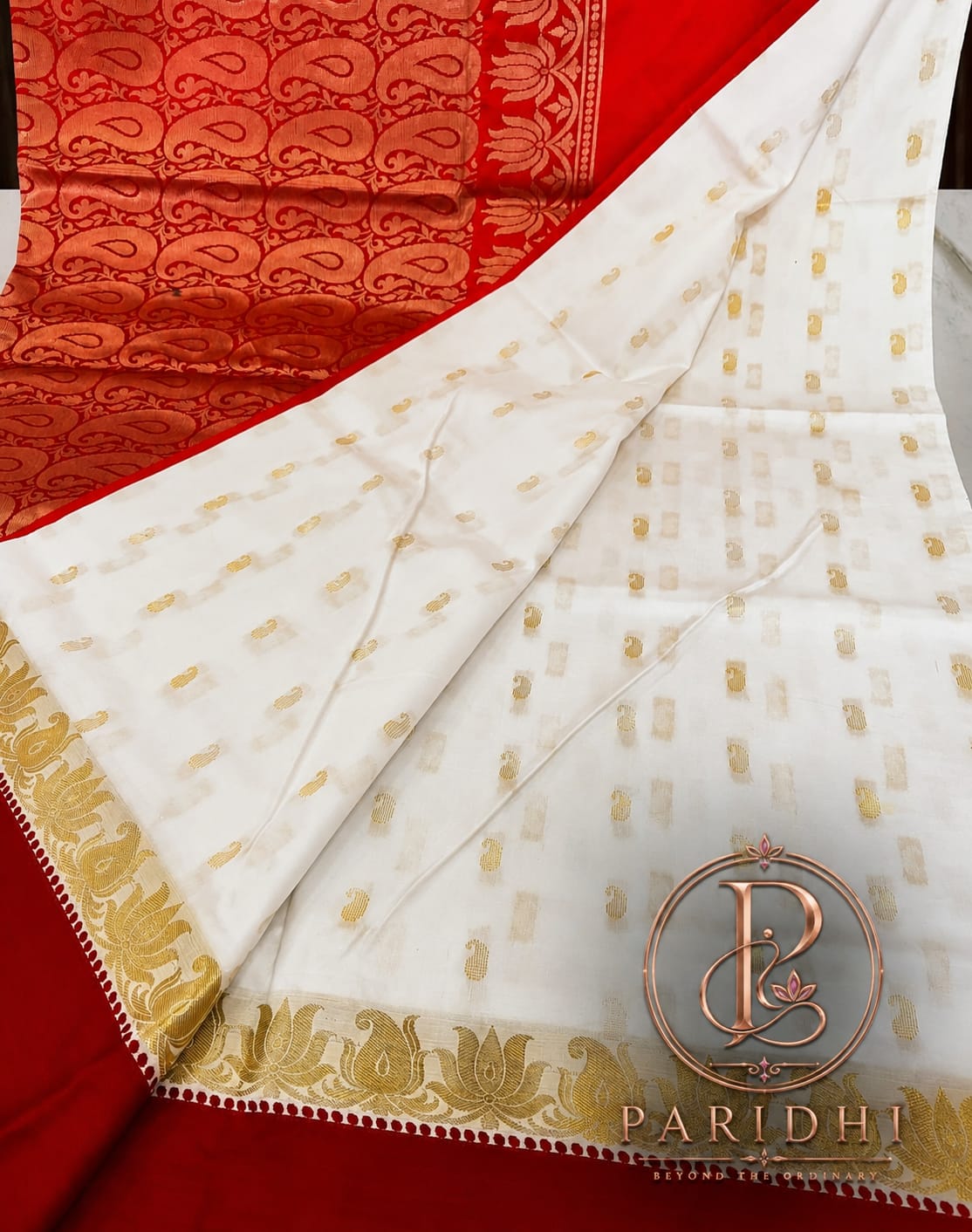 Close view of the white Garad body with golden buttas