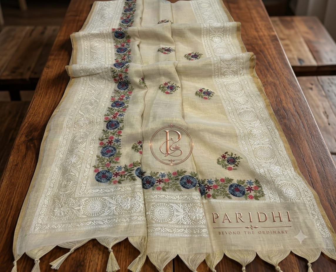 Ivory linen tissue saree with blue and coral resham embroidery