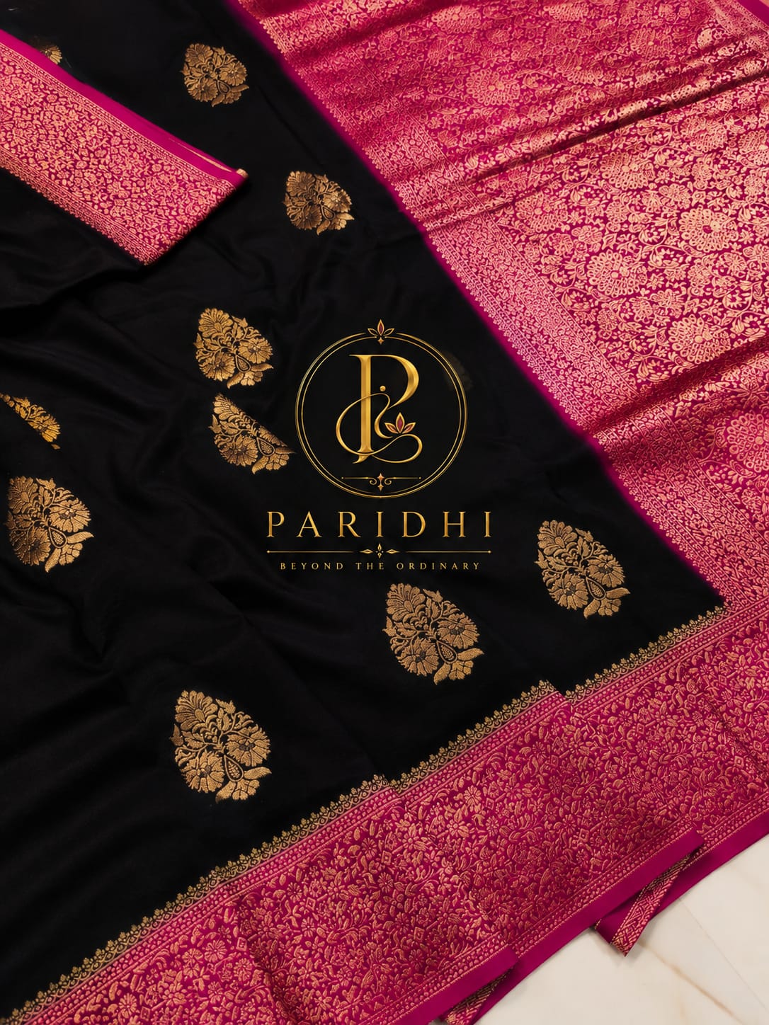 Black khaddi saree with rani pink contrast border and gold buttas