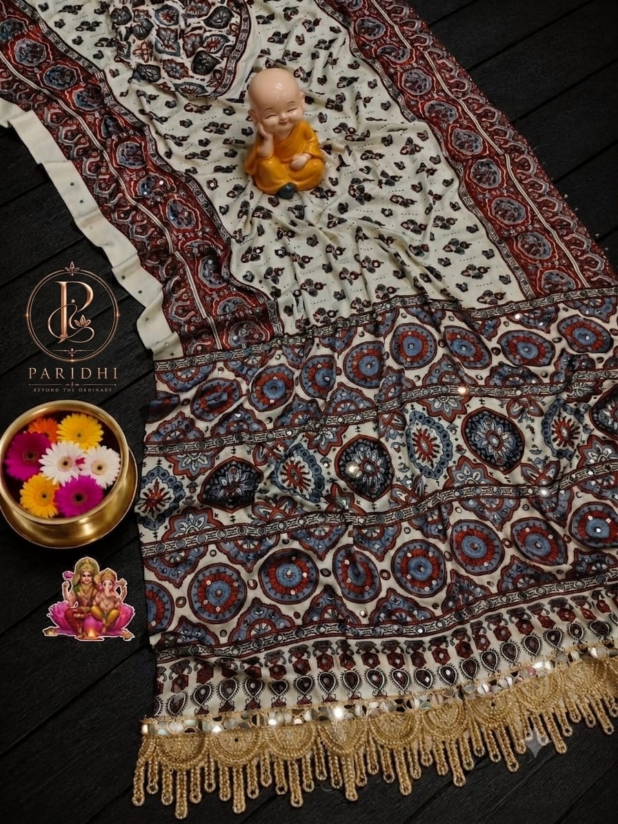 Ivory modal silk saree with maroon and blue printed pallu and mirror work