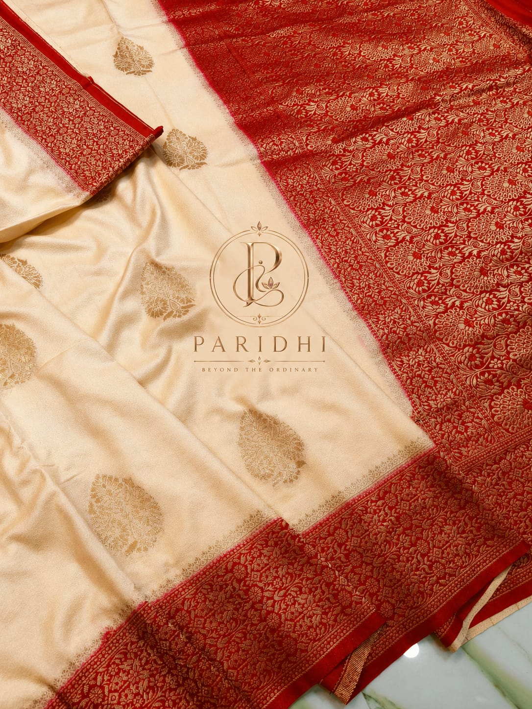 Ivory khaddi saree with red contrast border and golden jari buttas