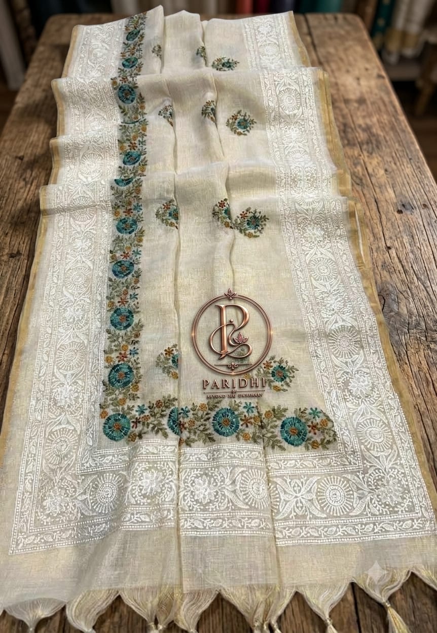 Ivory Bengal linen tissue saree with teal and rust resham embroidery