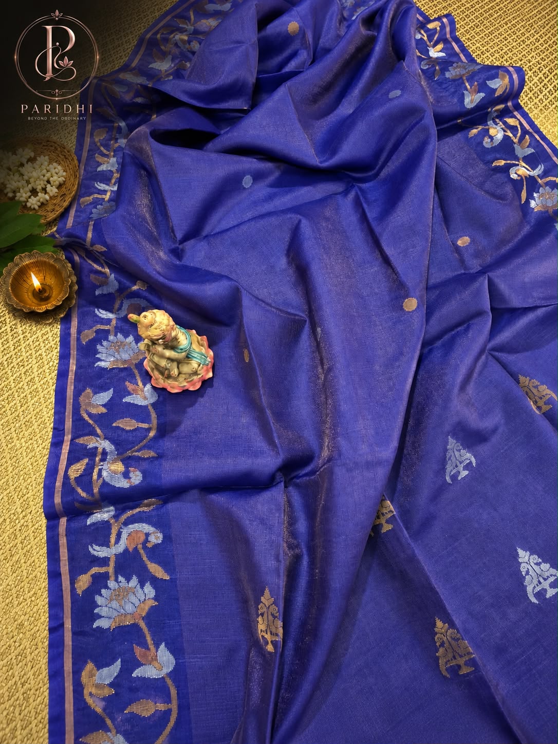 Royal blue tissue tassar Benarasi saree with hand-woven lotus creeper and gold buti