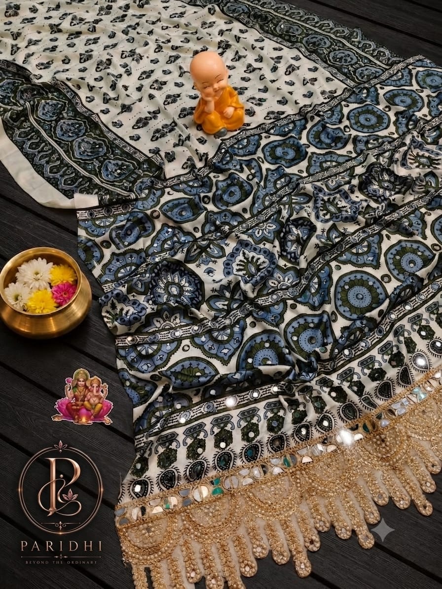 Ivory modal silk saree with teal and olive print, mirror work and gold lace